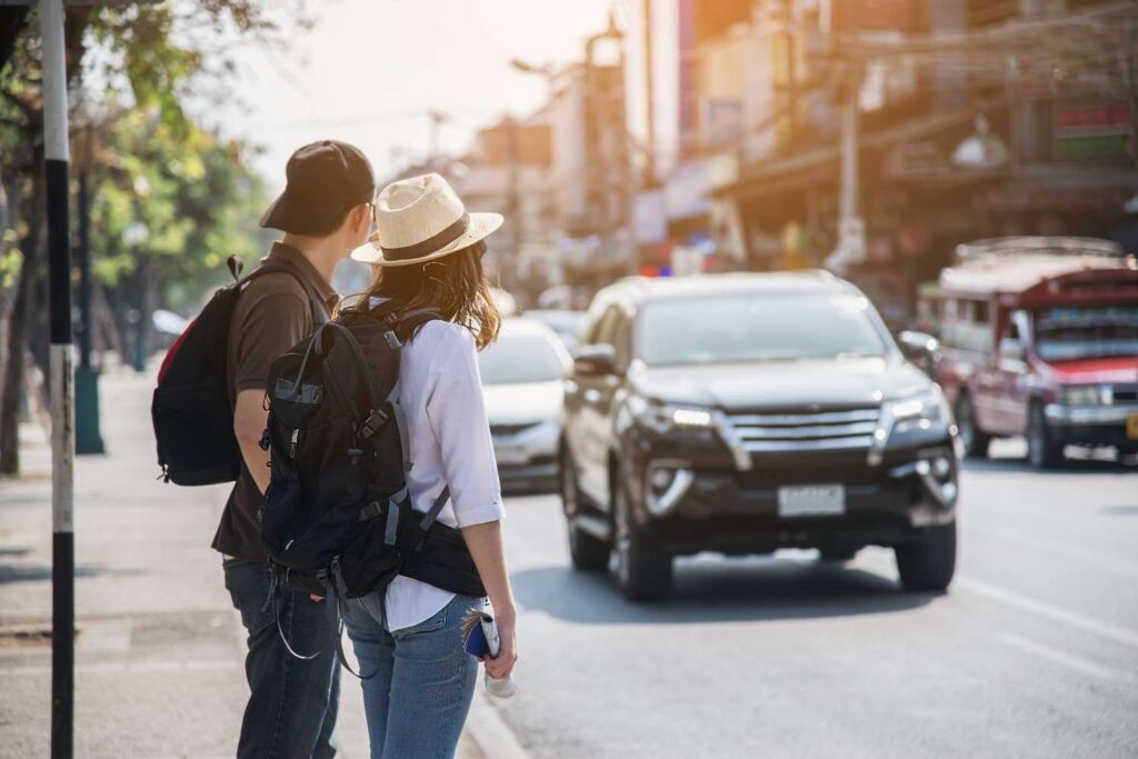 Two people exploring the city with a reliable taxi stony plain service for errands and daily outings.