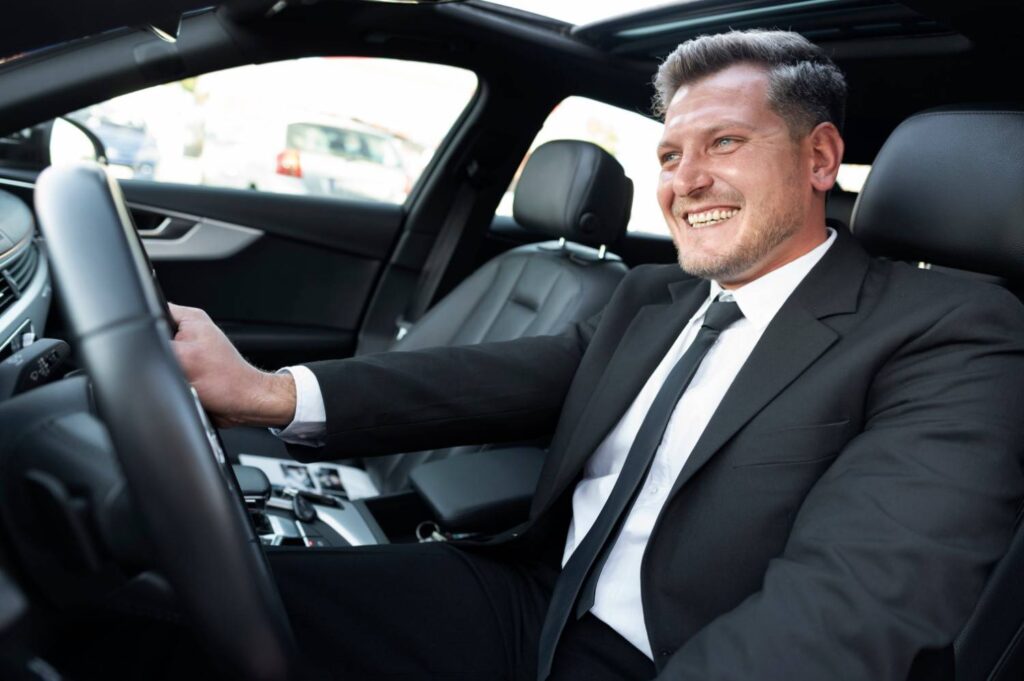 A happy driver enjoying a smooth, stress-free journey with a premium local cab service.