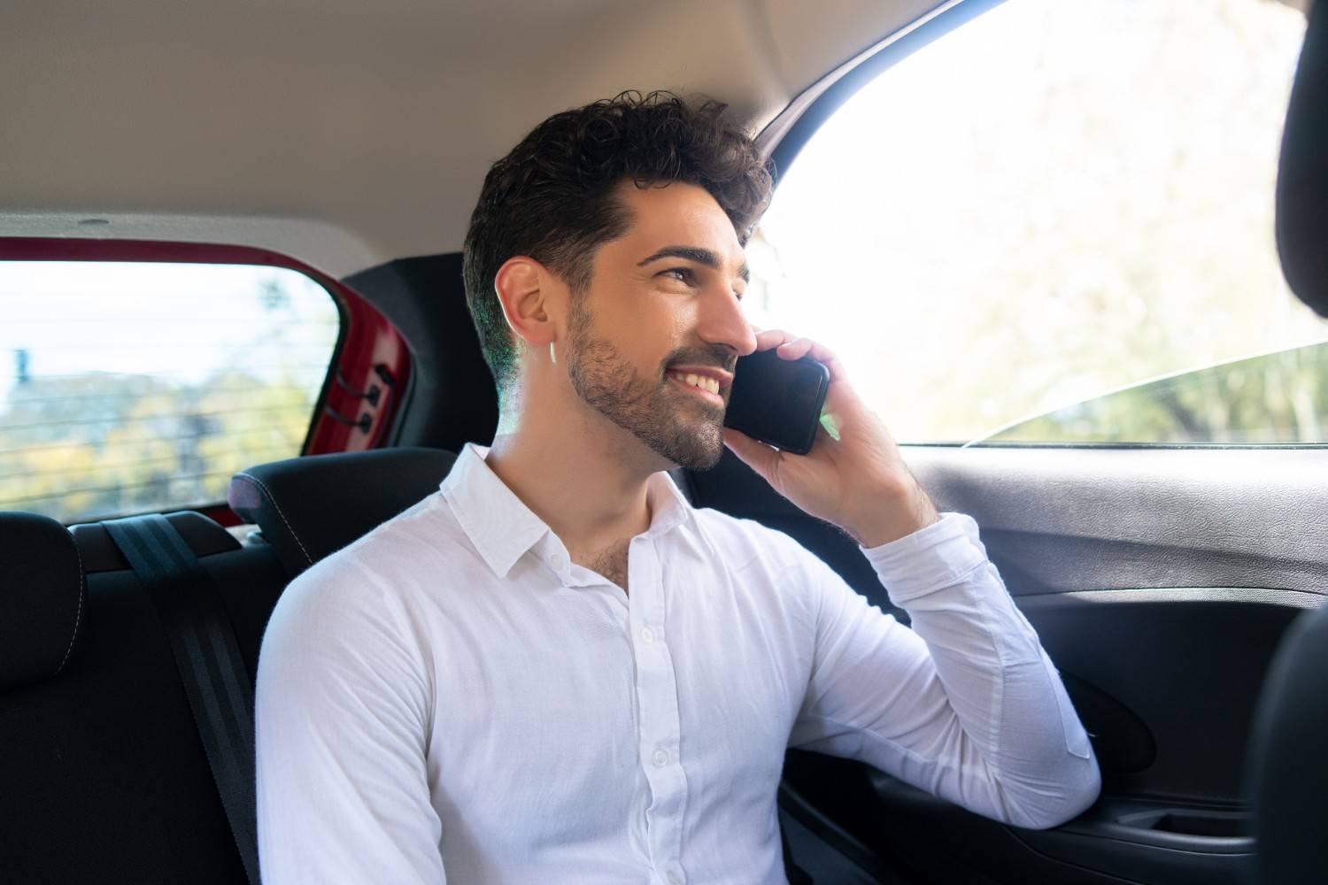 Smiling client using a reliable airport taxi provider for prompt local commutes and transit.