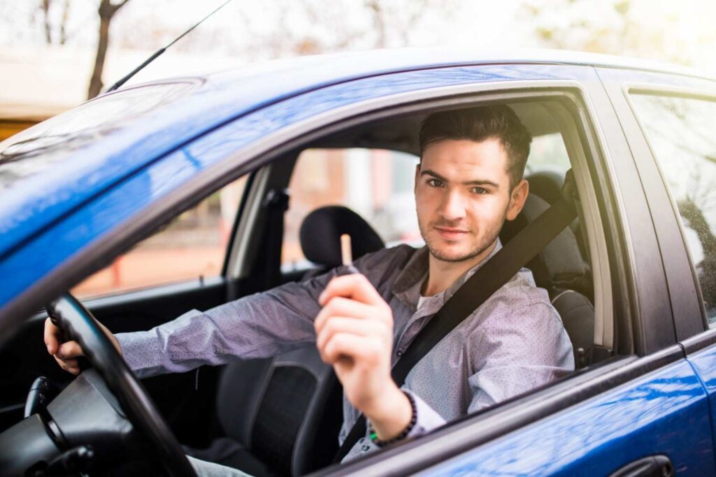 Professional driver holding car keys and offering a fast pickup for anyone needing a taxi near me in Stony Plain.